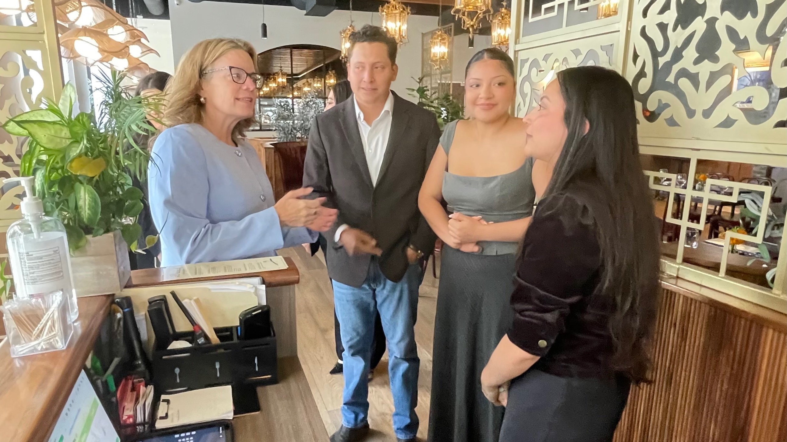 La Casa Del Tamal, where operator Cristina Olvera, puts a focus on family and tamales, drew a visit from U.S. Small Business Administration official Lisa Shimkat, left. Shimkat is pictured with Olvera's son-in-law and two of her daughters during the visit on Thursday.