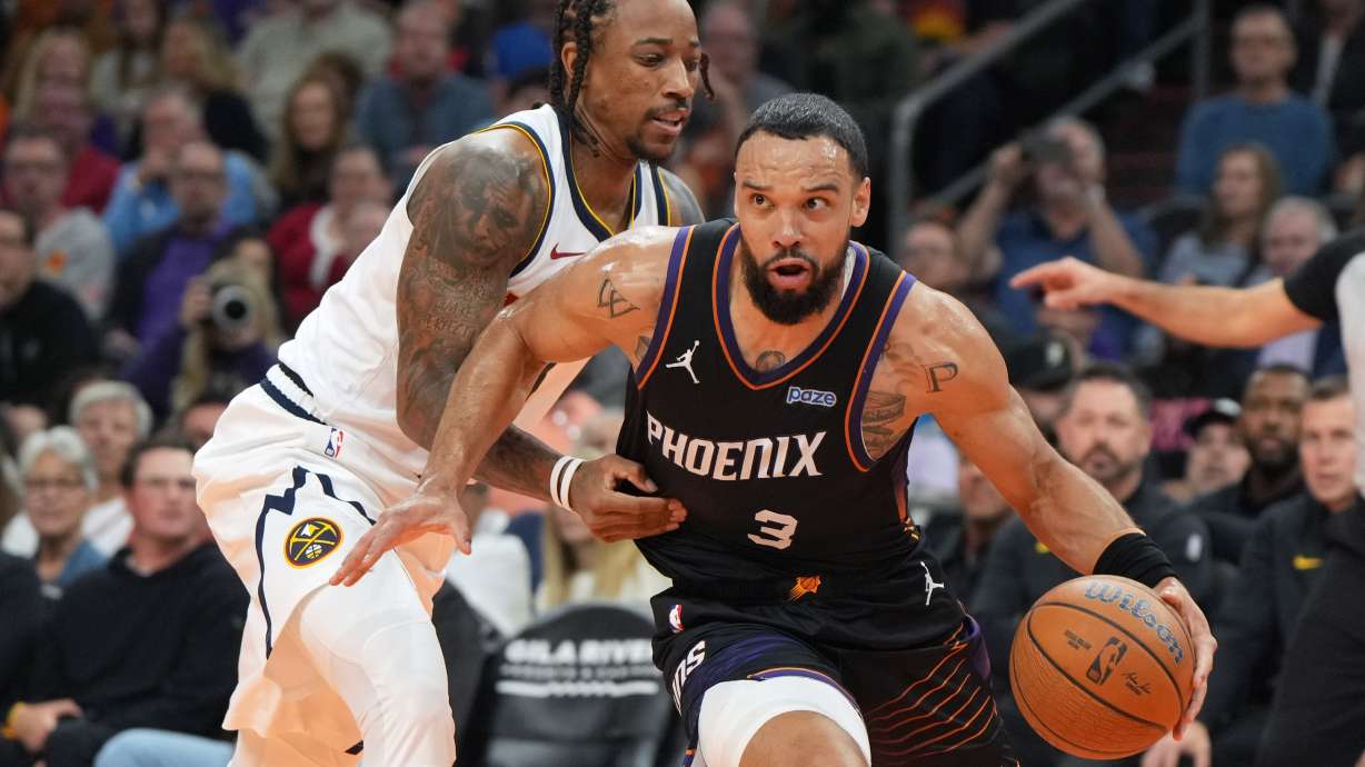 Phoenix Suns forward Dillon Brooks (3) drives around Denver Nuggets guard DeMar DeRozan, left, during the first half of an NBA Cup basketball game, Friday, Oct 30, 2026, in Phoenix.