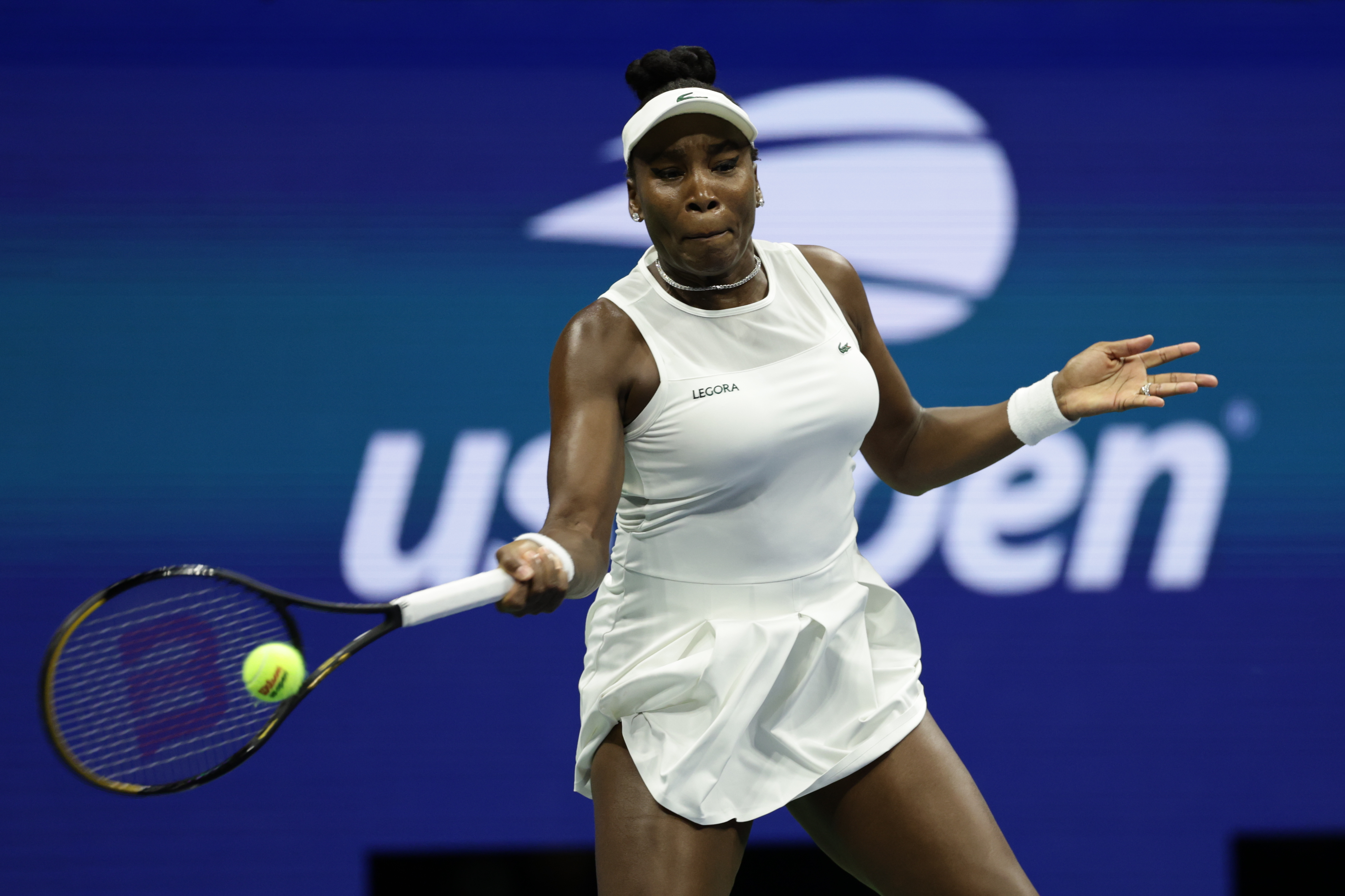 FILE - Venus Williams, of the United States, hits a return as she plays a women's doubles match with partner Serena Williams against Hao-Ching Chan, of Taiwan, and Maya Joint, at the U.S. Open tennis championships, Friday, Sept. 4, 2026, in New York. 