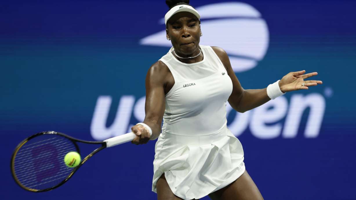 FILE - Venus Williams, of the United States, hits a return as she plays a women's doubles match with partner Serena Williams against Hao-Ching Chan, of Taiwan, and Maya Joint, at the U.S. Open tennis championships, Friday, Sept. 4, 2026, in New York.
