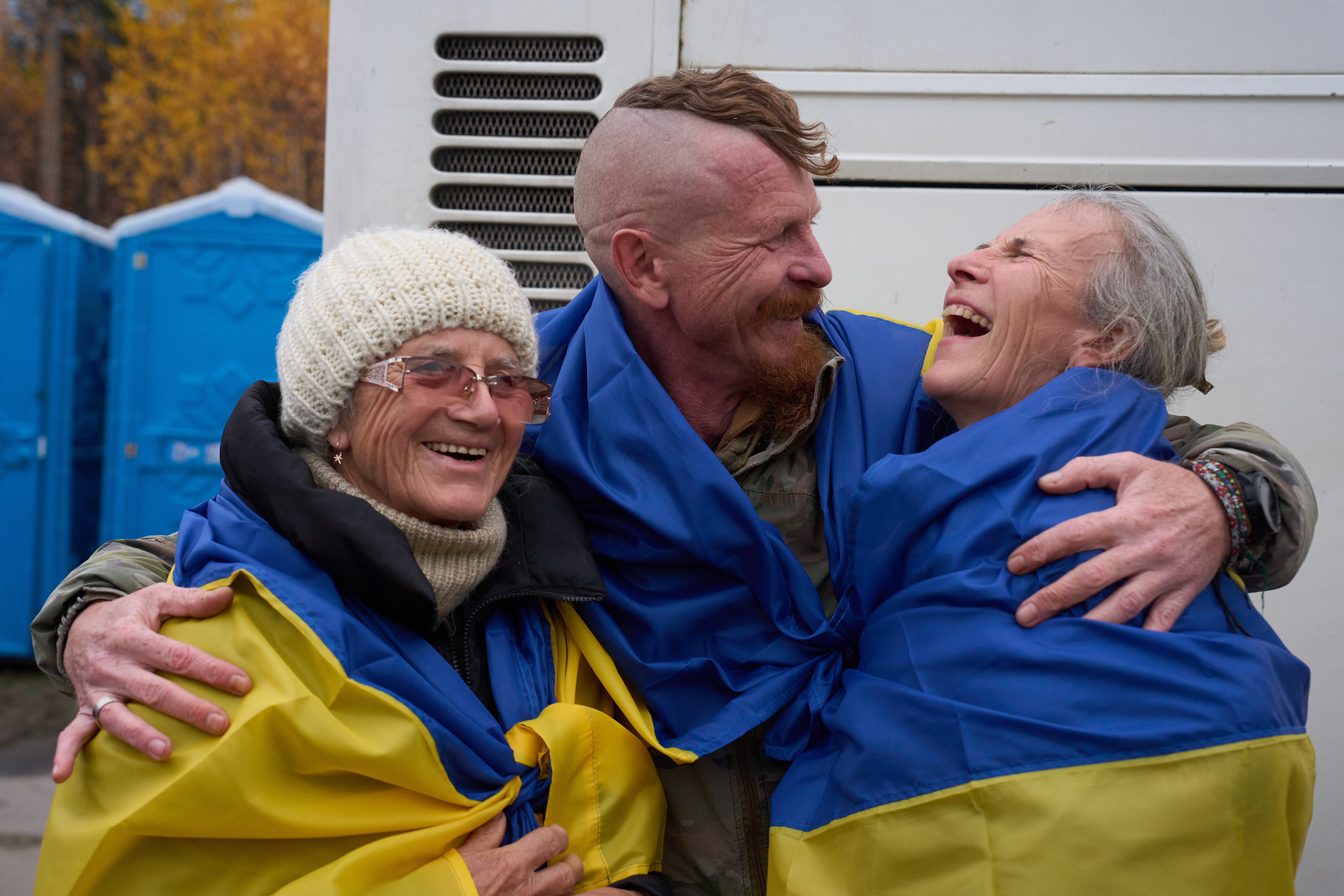 Evacuees reunite with family at the Ukrainian-Belarusian border after fleeing Oleshky