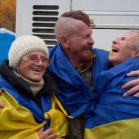 Evacuees reunite with family at the Ukrainian-Belarusian border after fleeing Oleshky