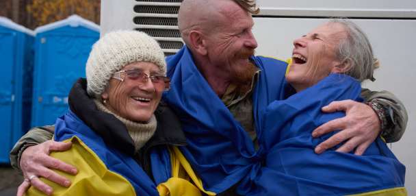 Evacuees reunite with family at the Ukrainian-Belarusian border after fleeing Oleshky