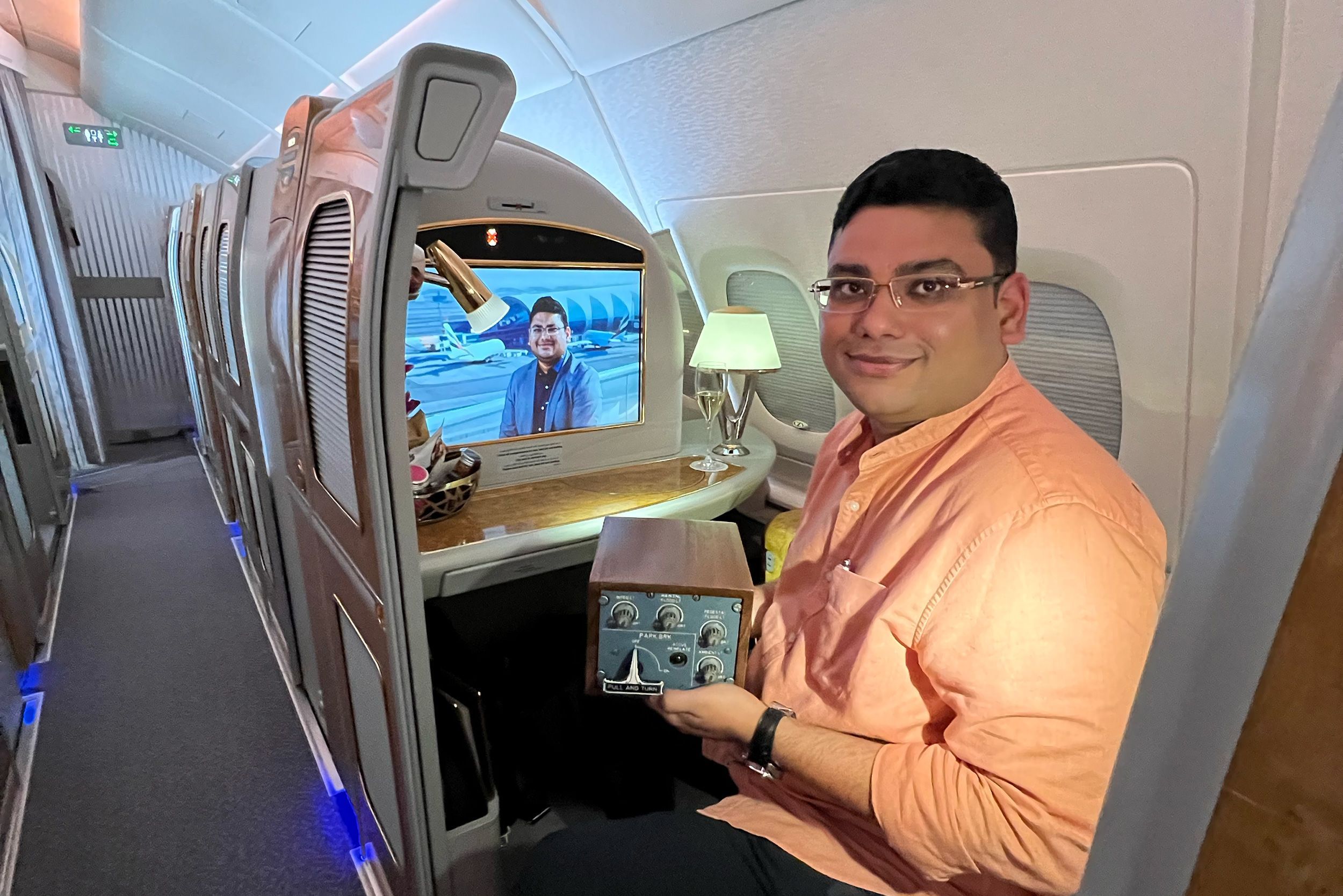 Arun Rajagopal, holding an Emirates A380 parking brake while a documentary featuring the A380 superfan plays in the background.