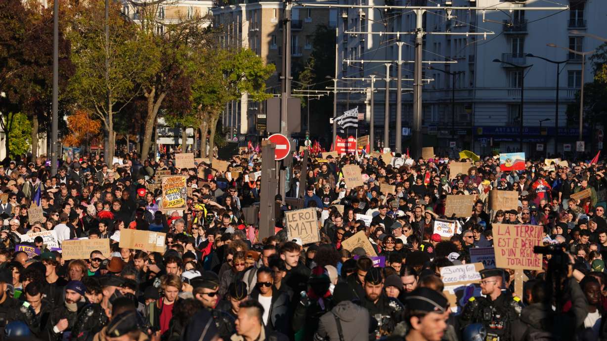 Protesters march during a demonstration against rising living costs in Paris on Saturday.