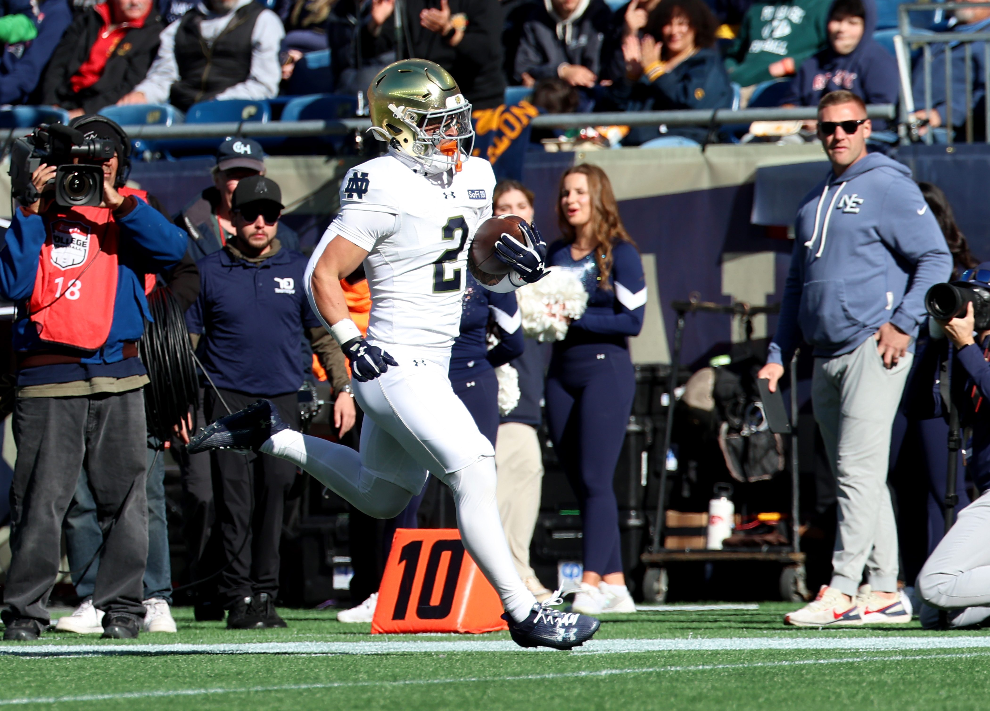 Notre Dame running back Nolan James Jr. (2) runs in for a touchdown during the first half of an NCAA college football game against Navy, Saturday, Oct. 31, 2026 in Foxborough, Mass. 