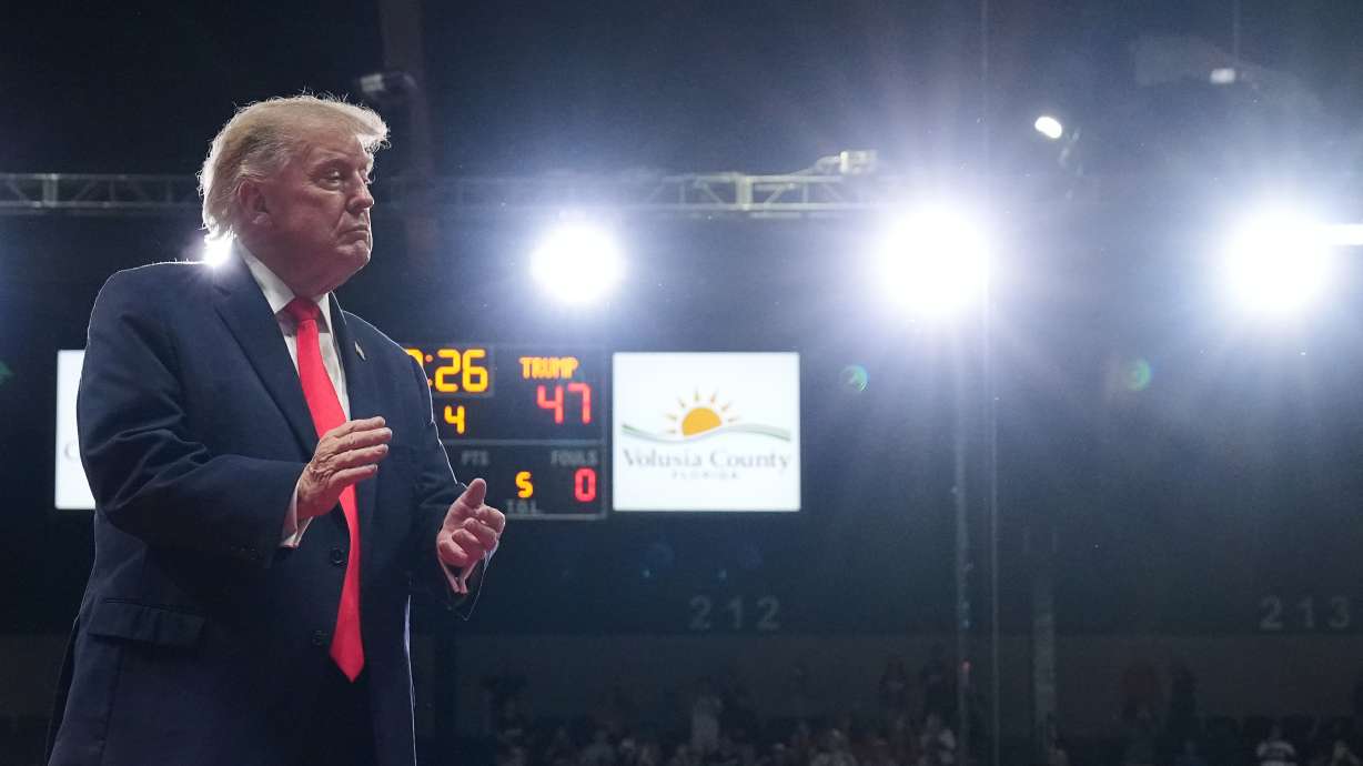 President Donald Trump walks from the podium after speaking at a campaign rally at the Ocean Center, in Daytona Beach, Fla., on Friday. Trump's lawsuit against The Wall Street Journal was dismissed with prejudice on Saturday.