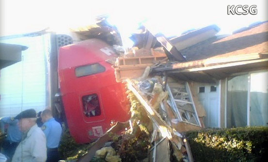 Tractor-trailer crashes into apartment, killing driver