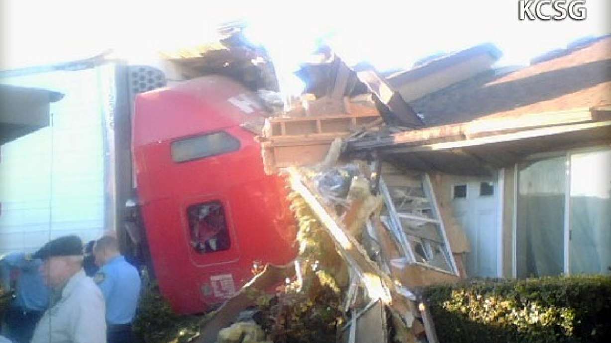 Tractor-trailer crashes into apartment, killing driver