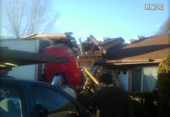 Tractor-trailer crashes into apartment, killing driver