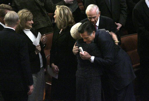 Republican presidential hopeful former Massachusetts Gov. Mitt Romney hugs a church member before the funeral service for Gordon B. Hinckley, president of the Church of Jesus Christ of Latter-day Saints in Salt Lake City, Saturday, Feb. 2, 2008. (AP Photo/LM Otero )
