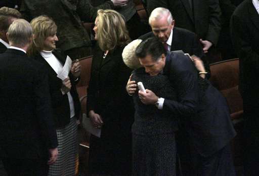 Republican presidential hopeful former Massachusetts Gov. Mitt Romney hugs a church member before the funeral service for Gordon B. Hinckley, president of the Church of Jesus Christ of Latter-day Saints in Salt Lake City, Saturday, Feb. 2, 2008. (AP Photo/LM Otero )