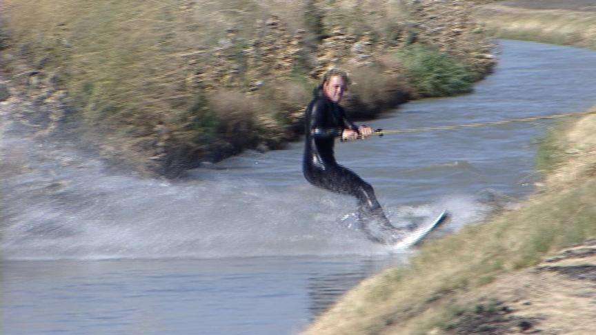 Australian Surfers Ride the Waves in Bluffdale Canal