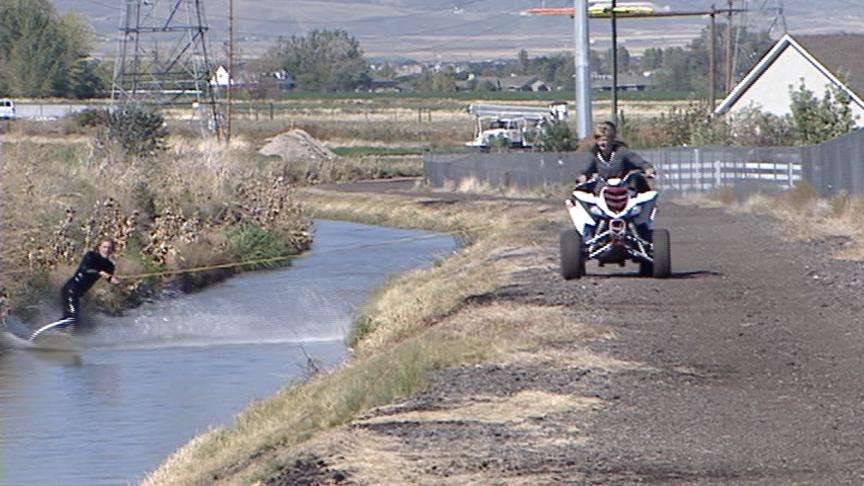 Australian Surfers Ride the Waves in Bluffdale Canal