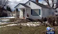 Fugitive crashes car onto porch