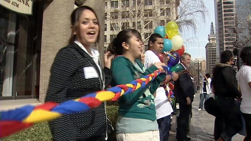 Students wrap building in friendship bracelet