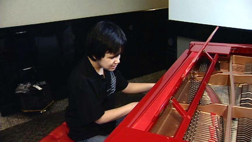 Musical savant plays on special piano