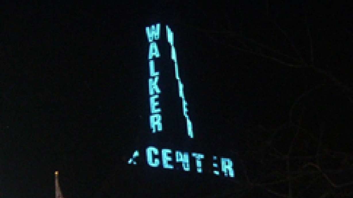 Historic weather tower lights up skyline