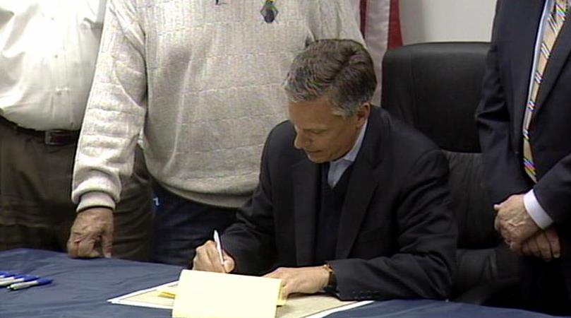 Governor signs mine safety bill on same day families of miners file lawsuit