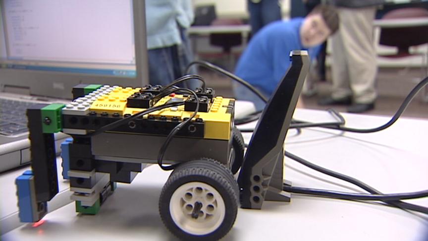 Students build and program robots made of Lego bricks