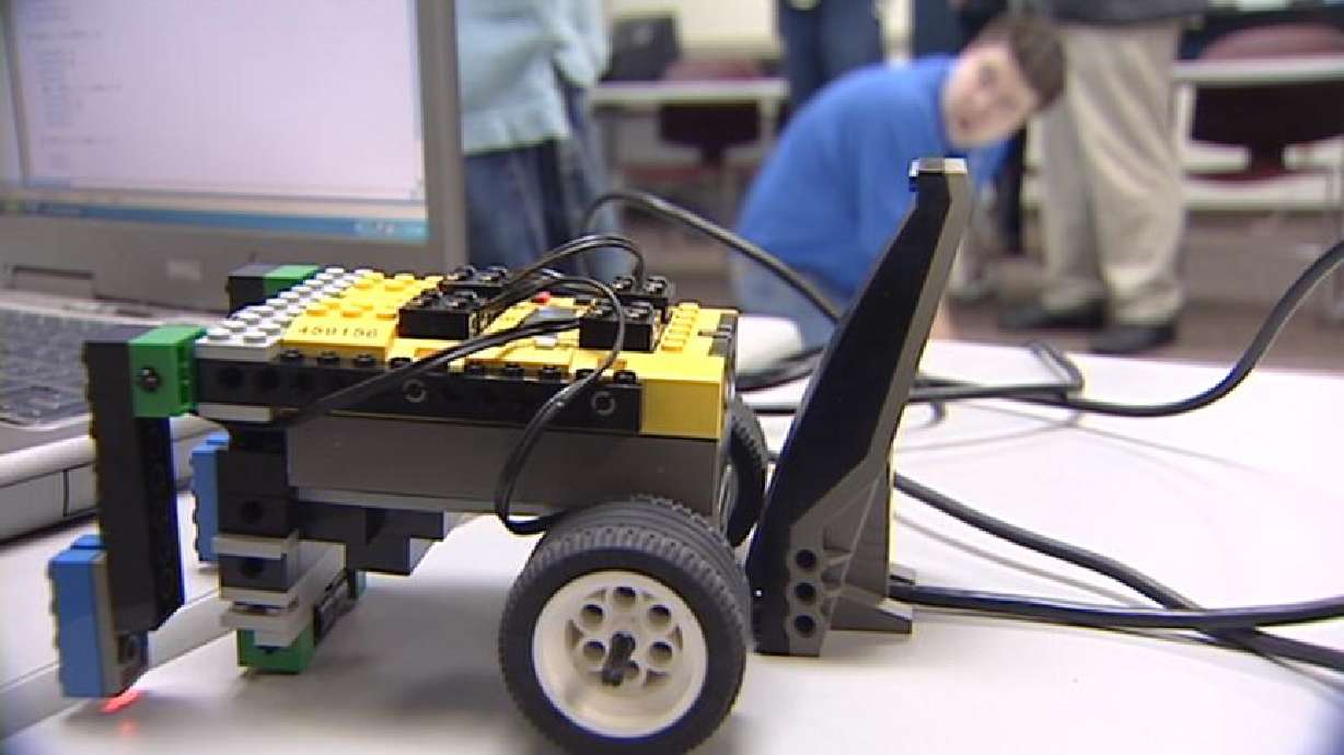 Students build and program robots made of Lego bricks