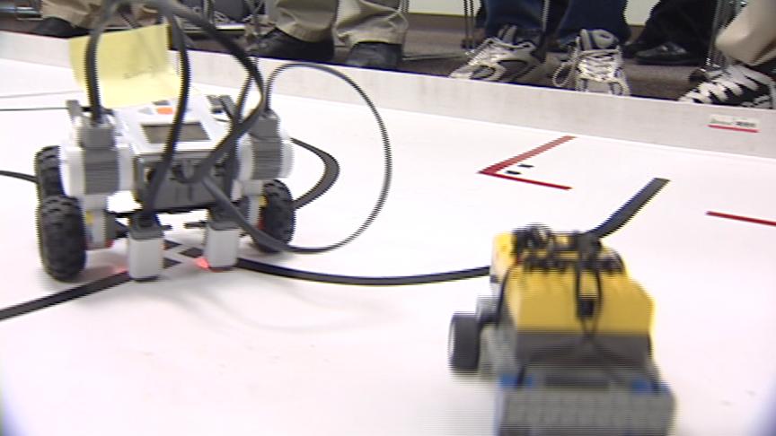 Students build and program robots made of Lego bricks