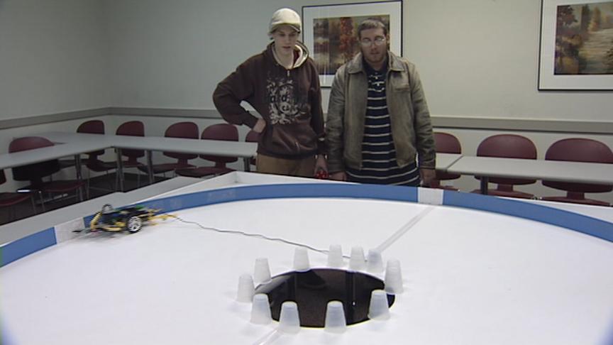 Students build and program robots made of Lego bricks