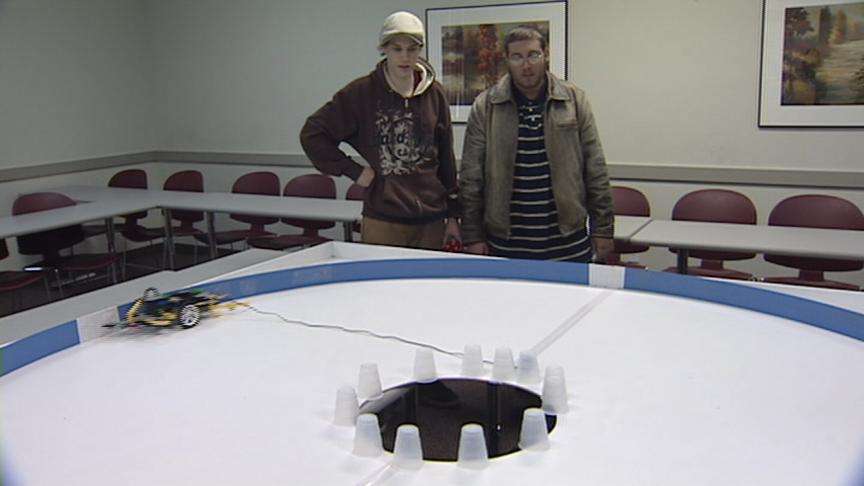 Students build and program robots made of Lego bricks