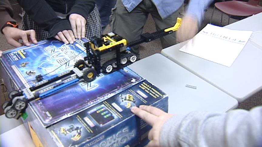 Students build and program robots made of Lego bricks