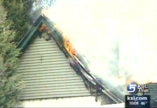 Flames shoot through the roof of Pleasant View home