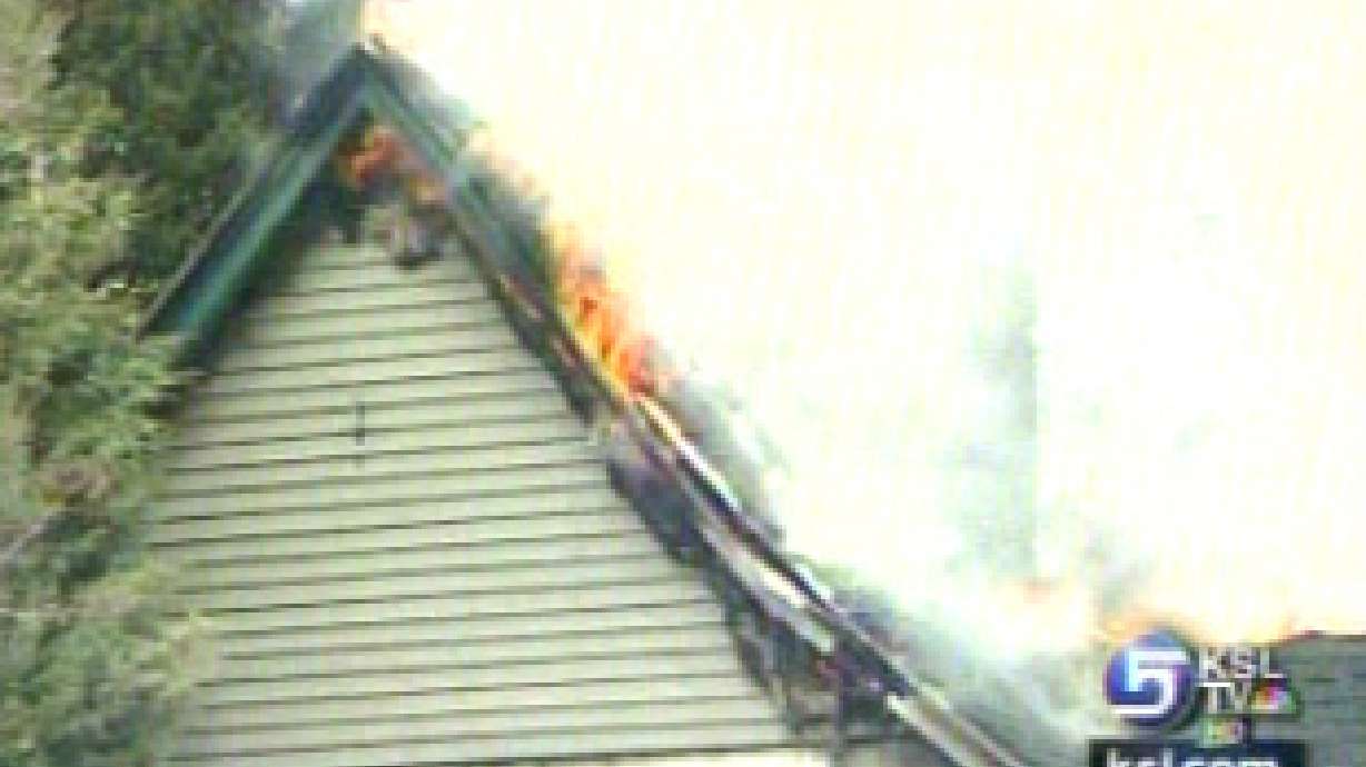 Flames shoot through the roof of Pleasant View home