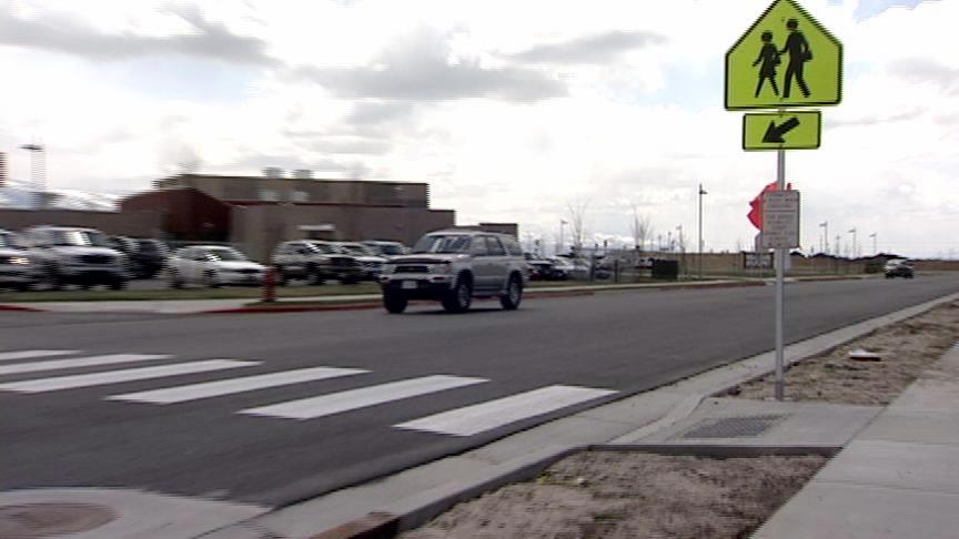 Charges have been filed against a Cottonwood Heights man accused of hitting the back of a woman's car multiple times while she was stopped at a crosswalk and waiting for students.