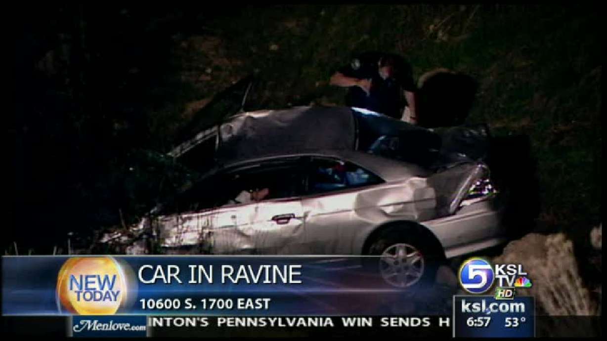 Car slides into ravine