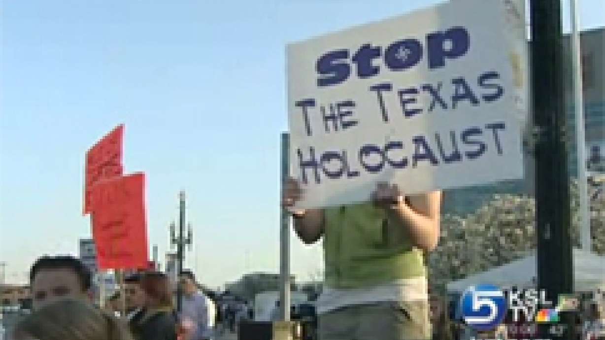Dozens protest FLDS issue at Jazz game
