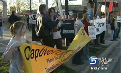 Dozens protest FLDS issue at Jazz game 