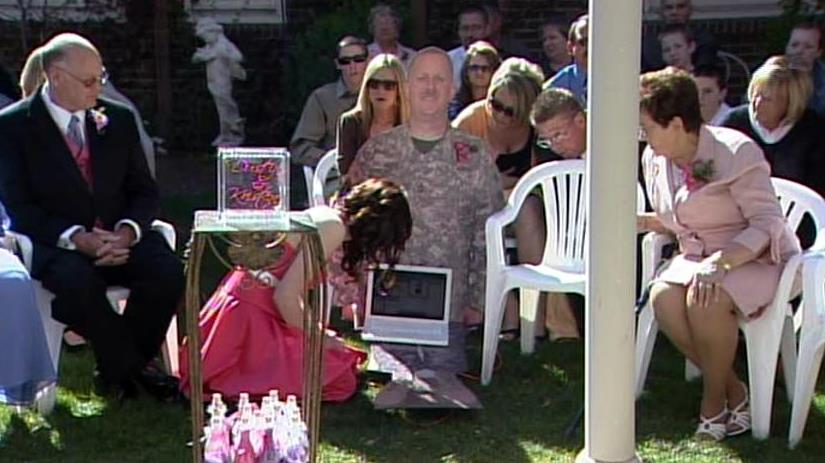 Father attends daughter's wedding via Webcam