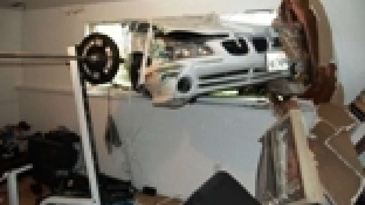 Teenager crashes car into home