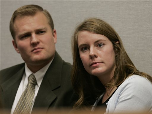 Julianna Redd Myers, 21, looks at her parents as her husband, Perry, looks on during a preliminary hearing against Julia and Lemuel Redd Wednesday, Dec. 6, 2006, in Provo, Utah. (AP Photo/Douglas C. Pizac, Pool)