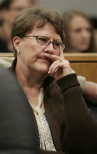 Julia Redd listens to her daughter, Julianna Redd Myers, testify against her during a preliminary hearing, Wednesday, Dec. 6, 2006, in Provo, Utah. She and her husband, Lemuel Redd are charged with kidnapping their daughter the day before her wedding in August. (AP Photo/Douglas C. Pizac, Pool)