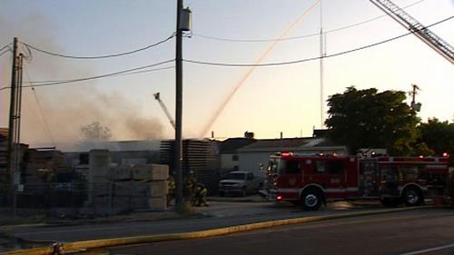 Neighbors calling for fire prevention requirements after lumberyard fire