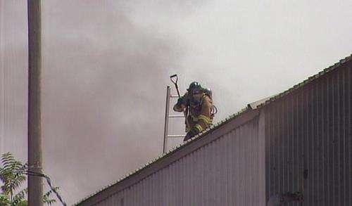 Roads reopened after crews extinguish downtown warehouse fire
