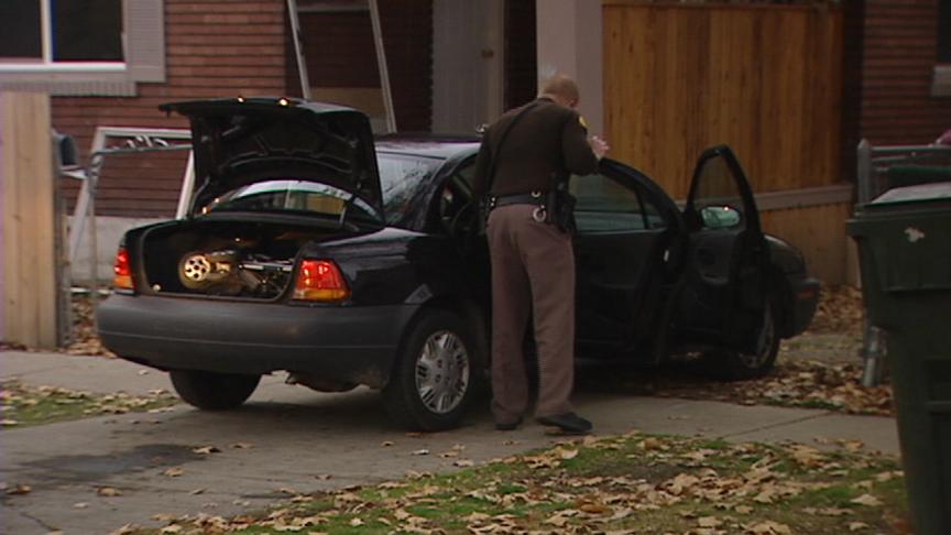 Officer Takes Woman into Custody for Stealing a Car