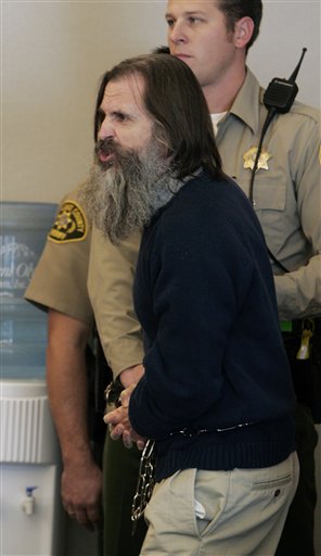 Brian David Mitchell, the alleged kidnapper of Elizabeth Smart, yells at the judge in court for his competency hearing Monday, Dec. 18, 2006, in Salt Lake City. Mitchell was again declared unfit to stand trial Monday after screaming at a judge to "forsake those robes and kneel in the dust." (AP Photo/Douglas C. Pizac, Pool)