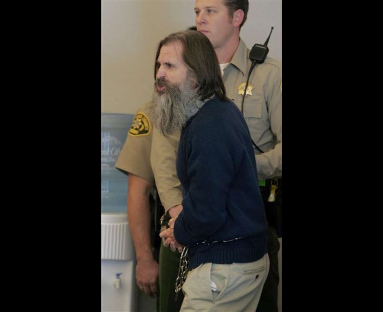Brian David Mitchell, the alleged kidnapper of Elizabeth Smart, yells at the judge in court for his competency hearing Monday, Dec. 18, 2006, in Salt Lake City. Mitchell was again declared unfit to stand trial Monday after screaming at a judge to "forsake those robes and kneel in the dust." (AP Photo/Douglas C. Pizac, Pool)