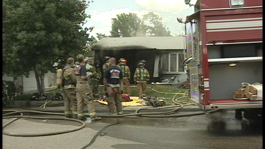 Heavy Smoke and Flames Pour from Home