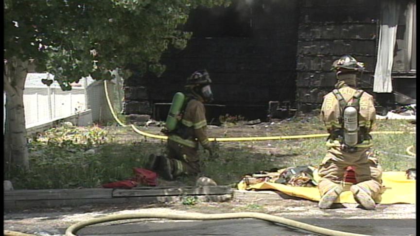 Heavy Smoke and Flames Pour from Home