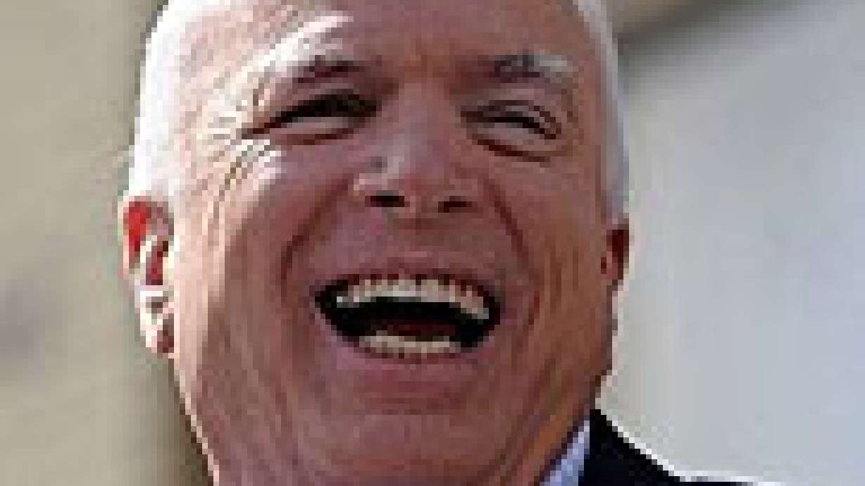 Why is this man smiling?