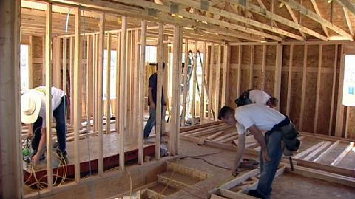Crews build first Habitat home in Springville