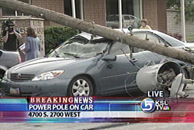 Live Power Pole Falls Onto Car