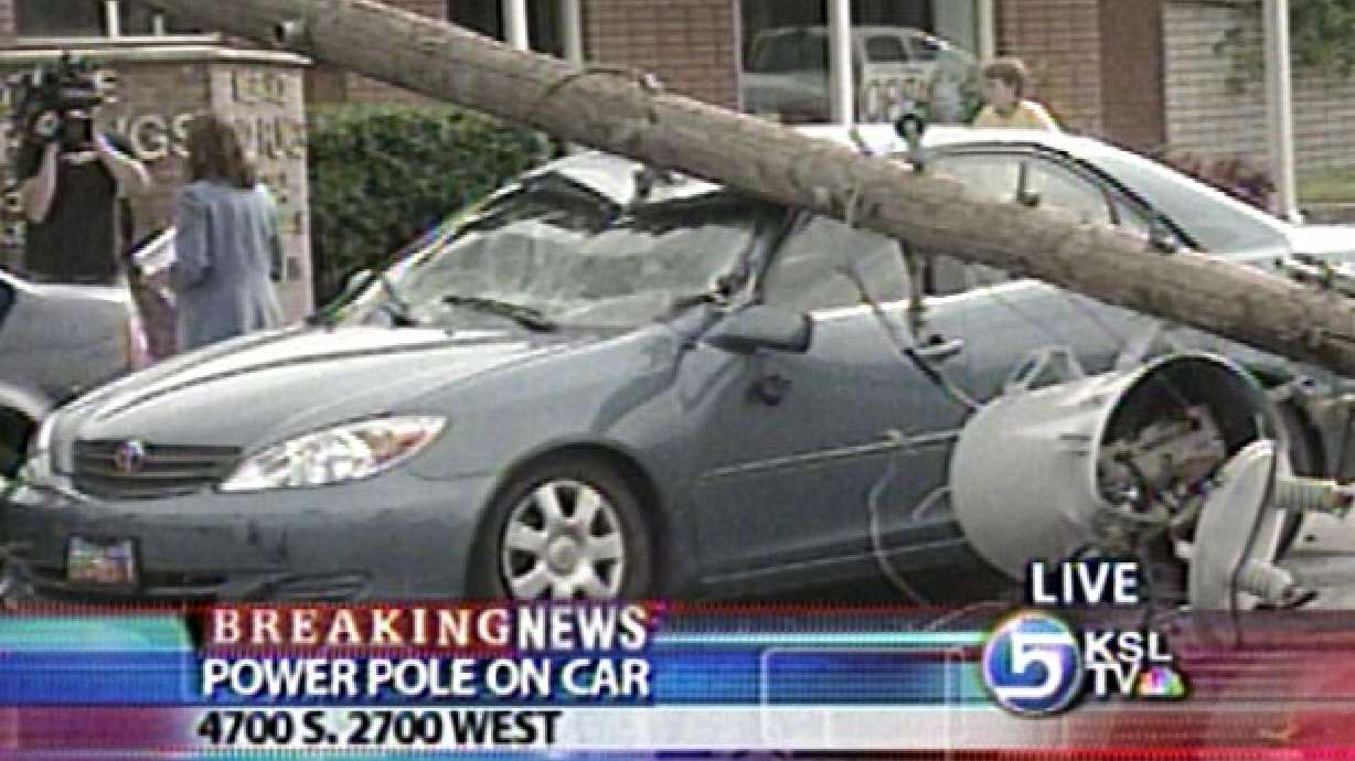 Live Power Pole Falls Onto Car